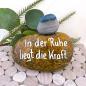 Preview: Glücksstein mit einem Spruch beschriftet und mit einem Trommelstein beklebt