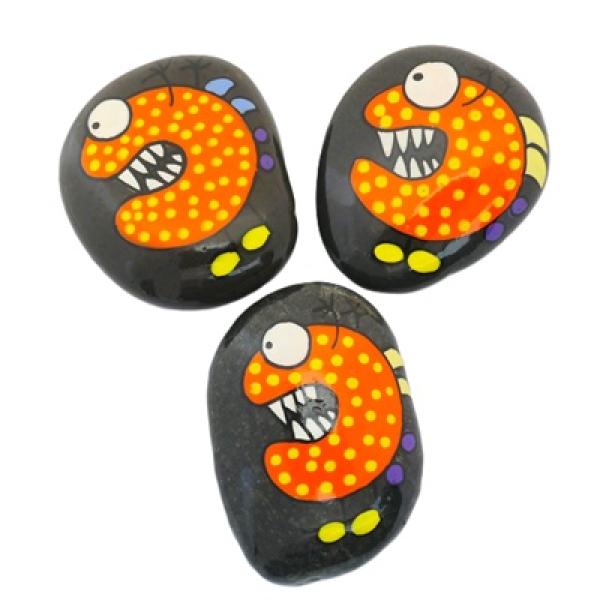 Lustige Monster Schmunzelsteine in orange