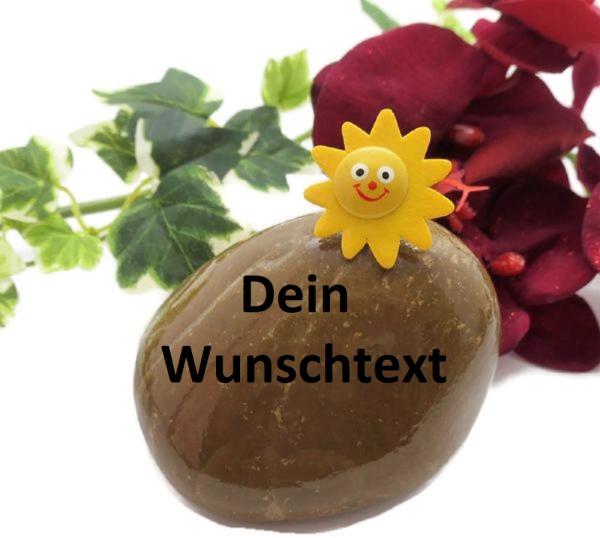 Glücksstein Sonne auf einem Kieselstein