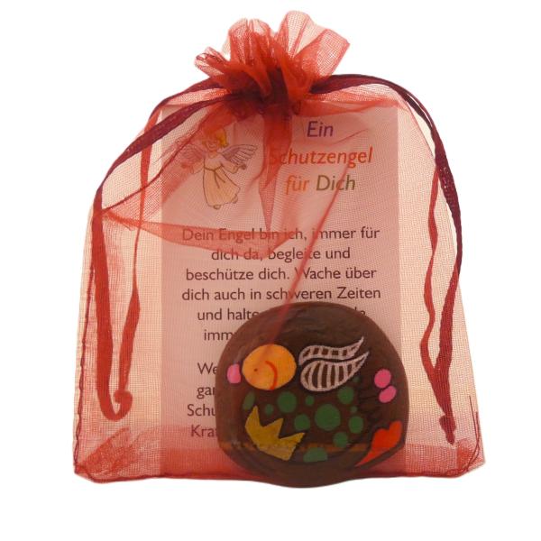 Engel Figur mit Karte in einem Organzabeutel
